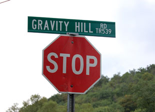 Gravity Hill Road sign