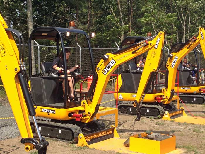 Kids digging with big diggers at Diggerland.