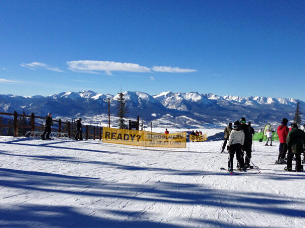 skiers on beginner ski slope