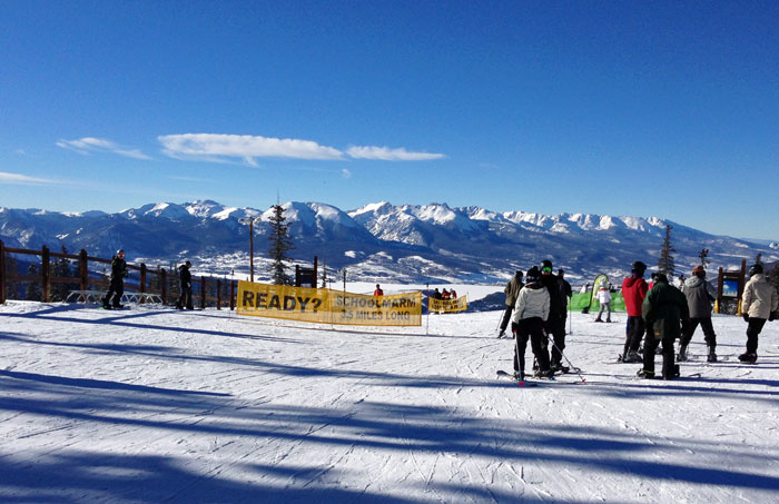 skiers on beginner ski slope