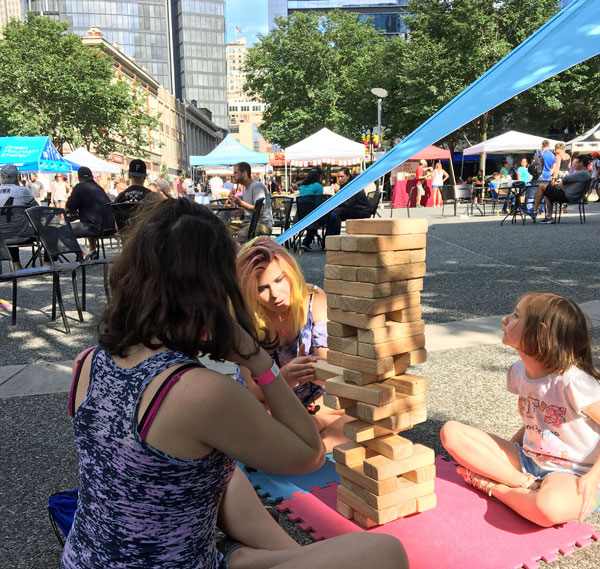 Playing giant Jenga in Market Square in Pittsburgh, PA.