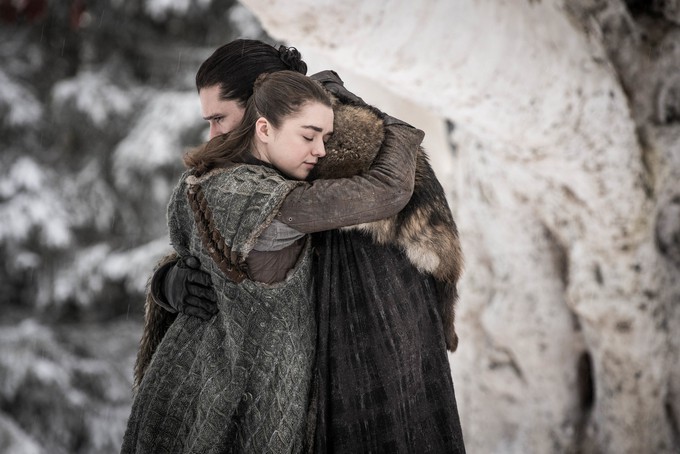Arya Stark and Jon Snow hug.