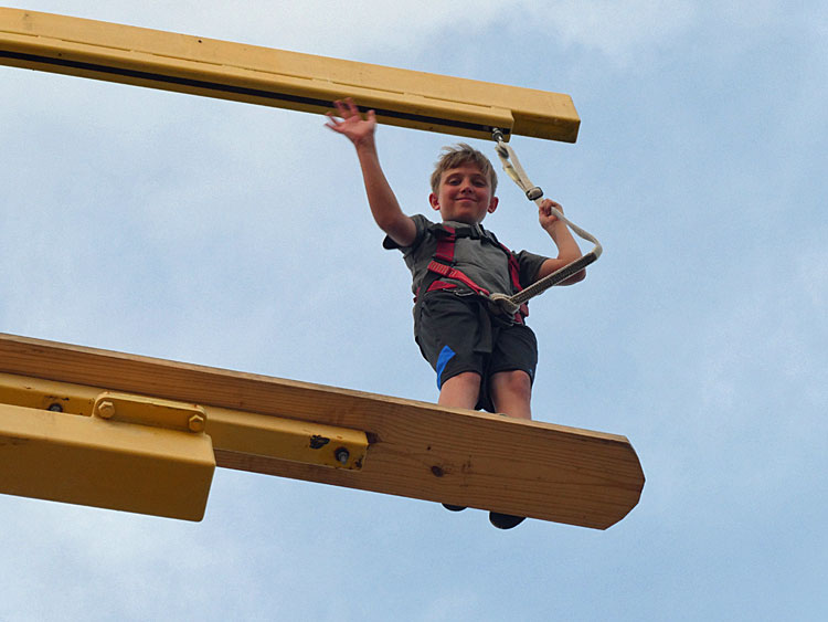 Boy on ropes course