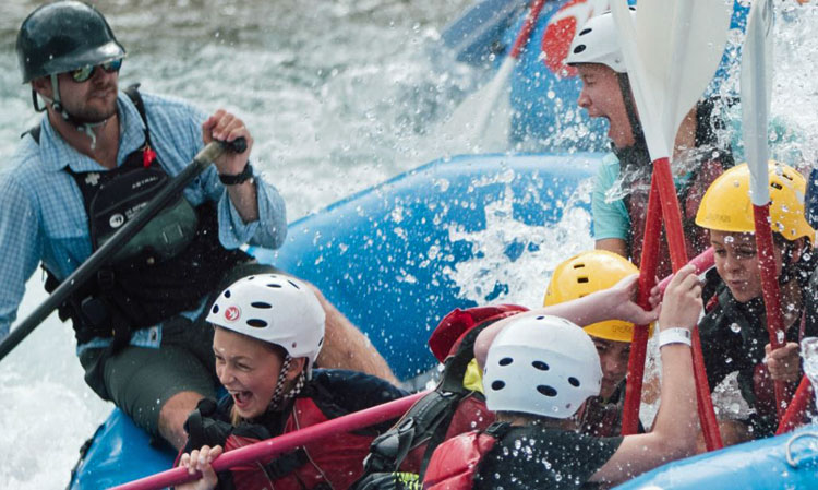 Kids having fun whitewater rafting