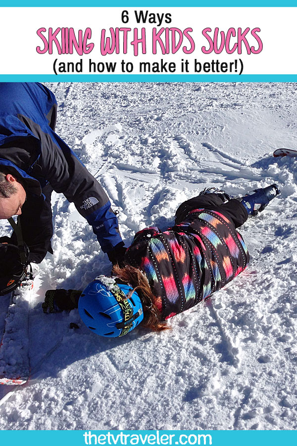 girl lying on ski slope