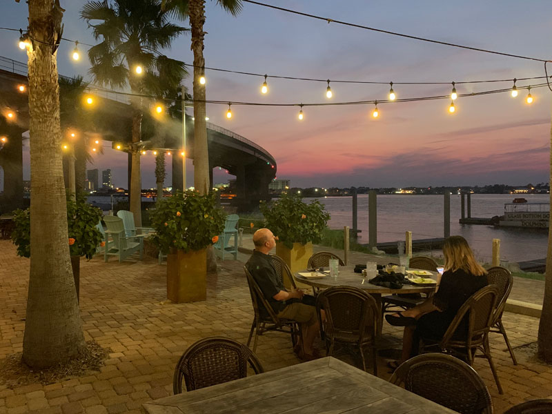 people eating dinner at sunset