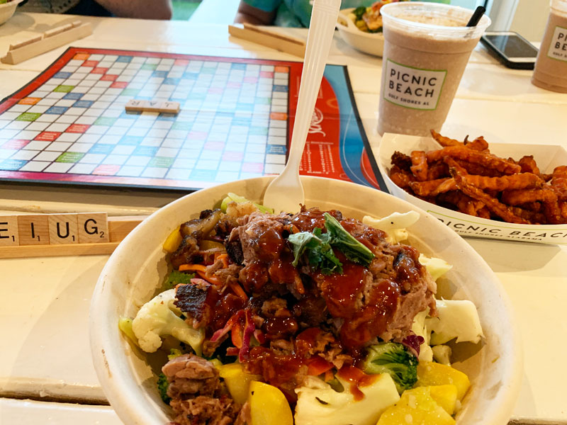 scrabble game and brisket bowl with fries