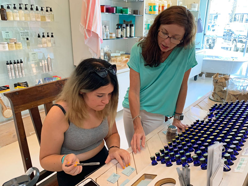 two women sampling bath scents