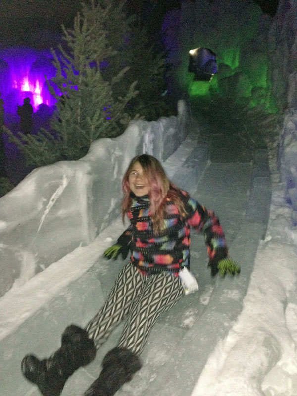 girl going down ice slide