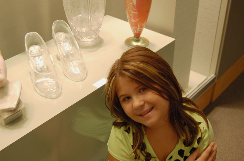 girl with glass slippers at museum