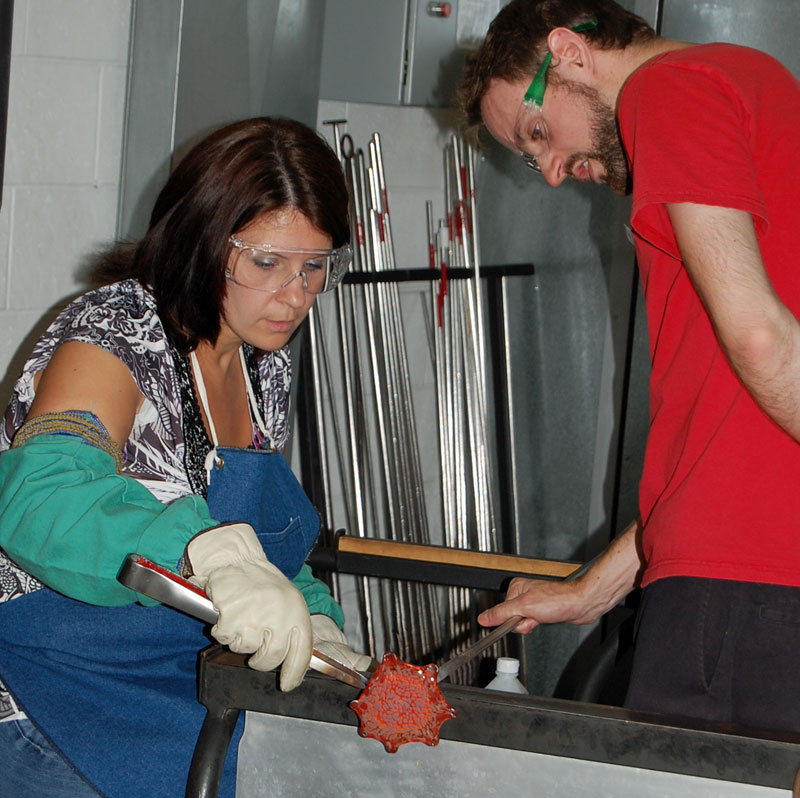 woman making glass flower