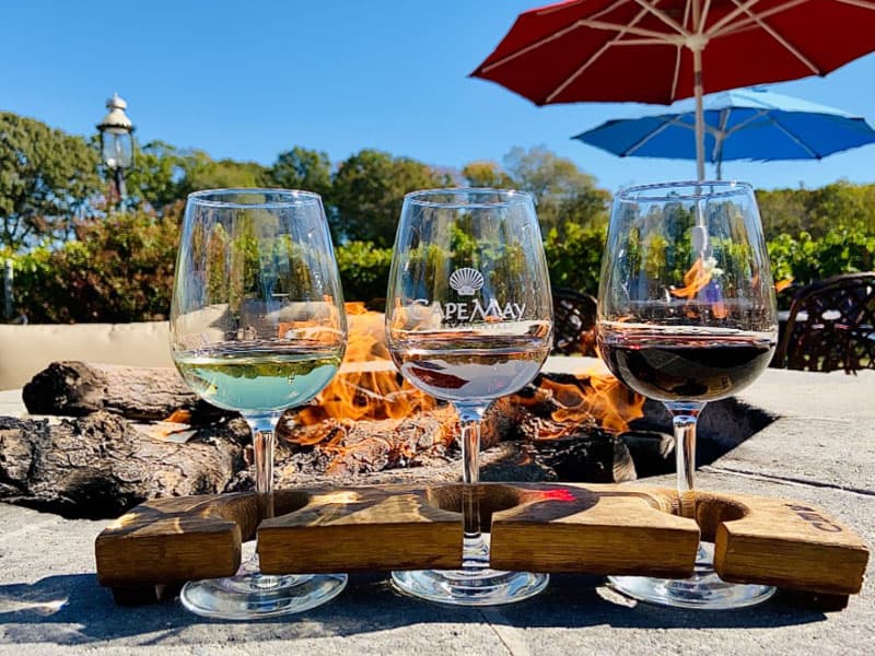 wine glasses and food on outdoor table