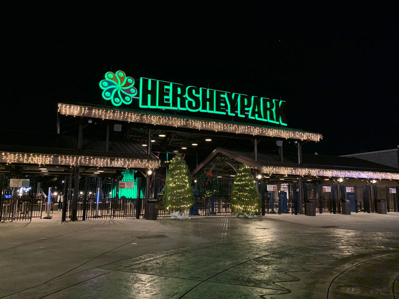 Hersheypark entrance decorated with Christmas lights.