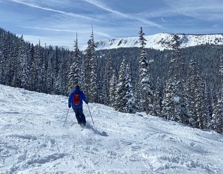 Man skiing in powder snow.